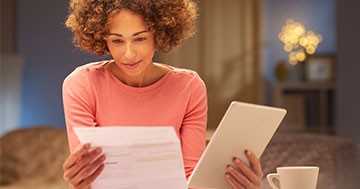 woman looking at energy bill