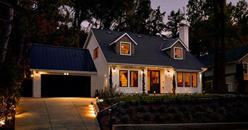 house at night with outside lights on