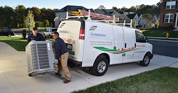 Constellation techs unloading AC unit to install