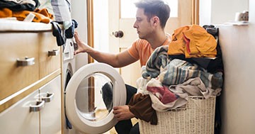 man doing laundry